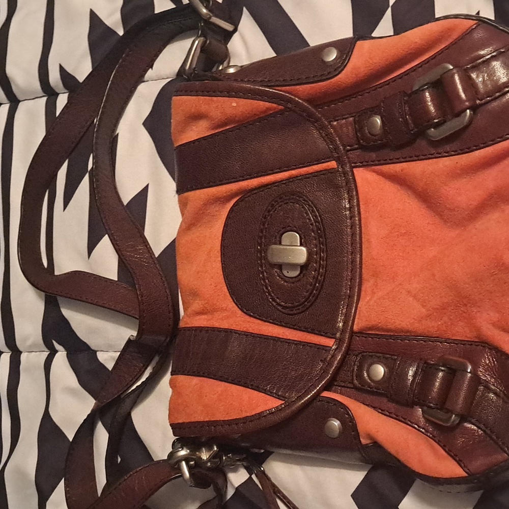 Fifty four fossil 2 color pocket book orange n brown